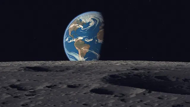 The whole Earth hangs large above the lunar horizon.